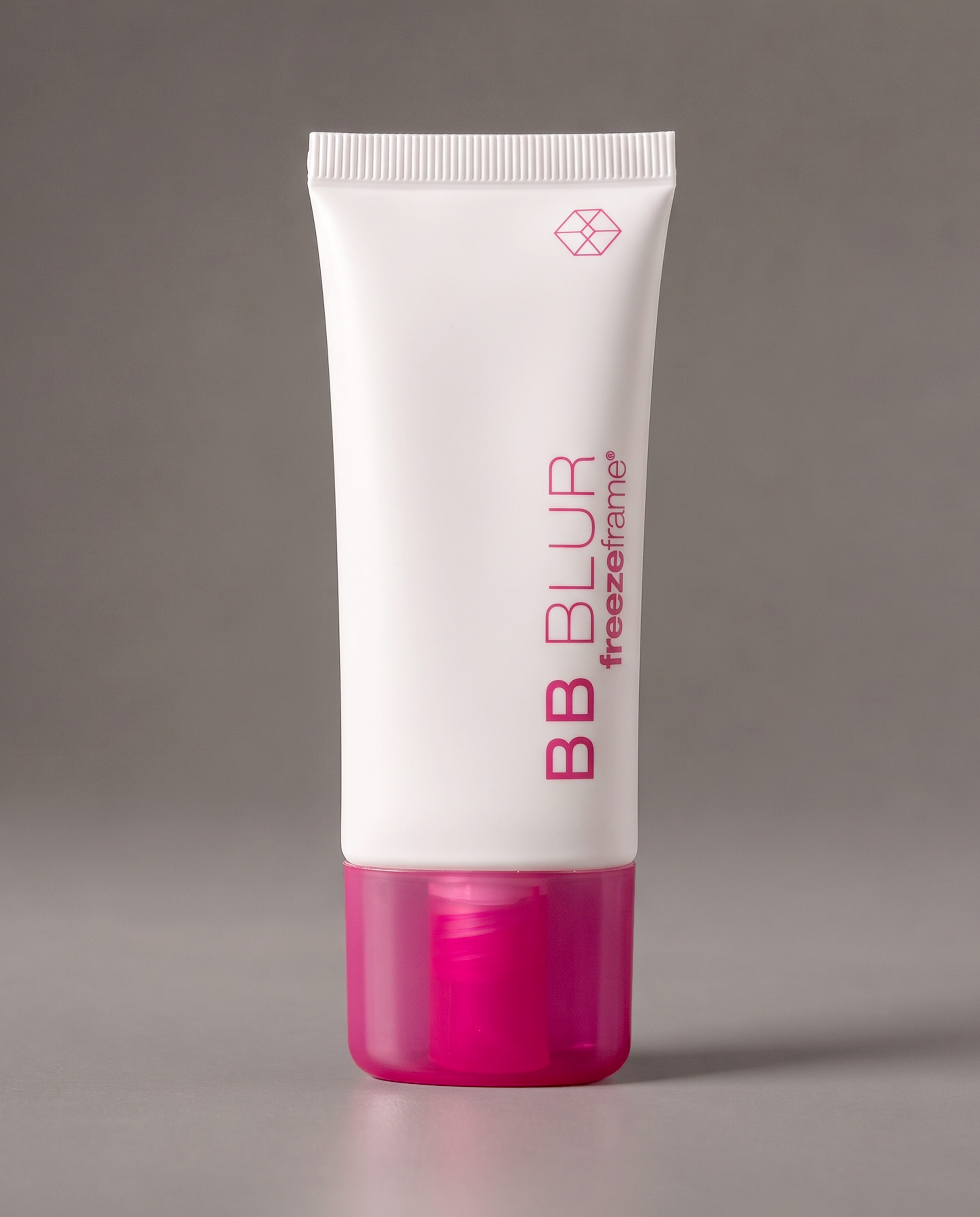 freezeframe BB BLUR skin-perfecting product in a white tube with a bright pink cap, designed to help visibly blur skin imperfections and create a smoother, more even-looking complexion.