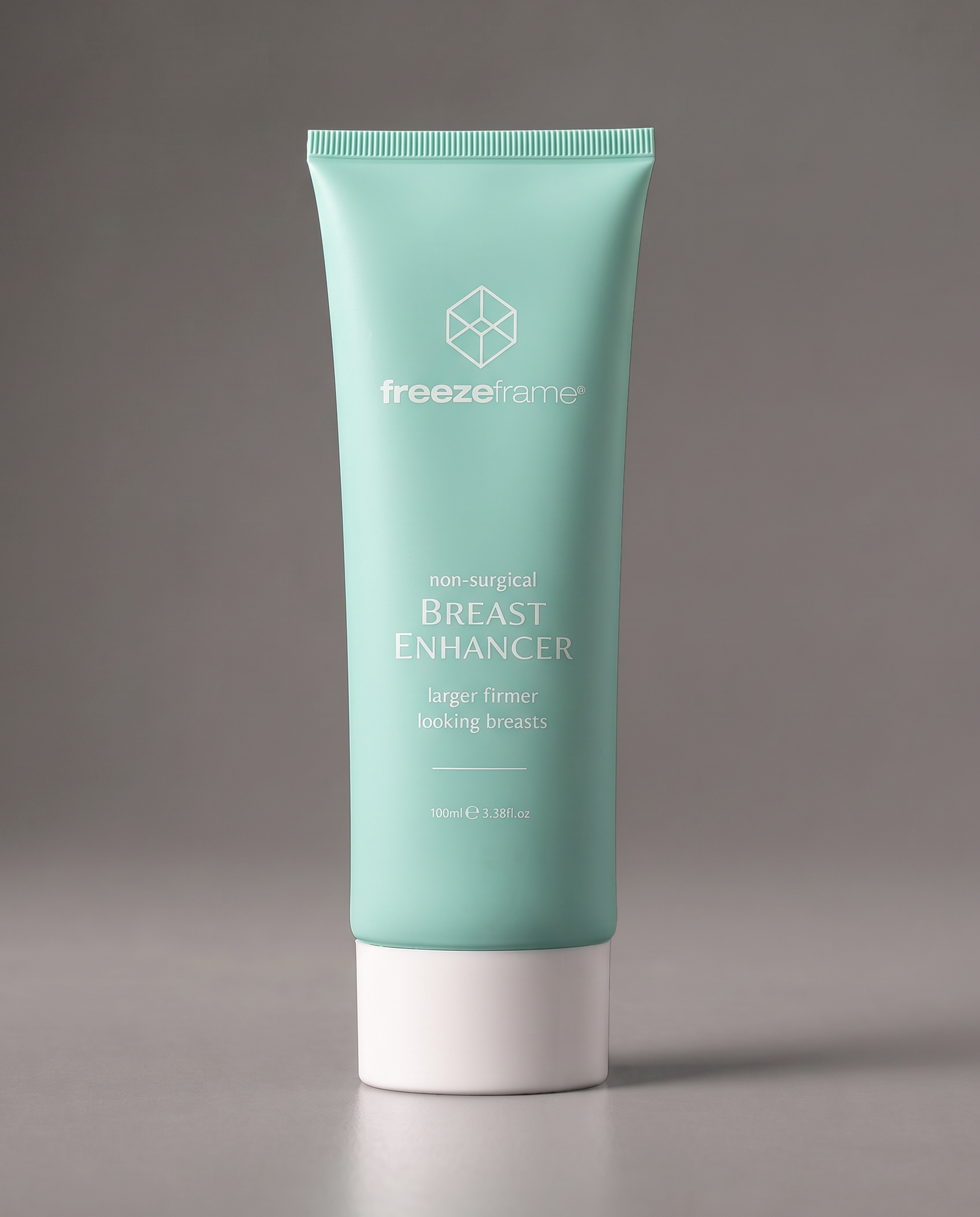freezeframe BREAST ENHANCER 100ml non-surgical breast enhancing cream in turquoise packaging, formulated to help improve the appearance of breast fullness and firmness for larger, firmer-looking breasts.