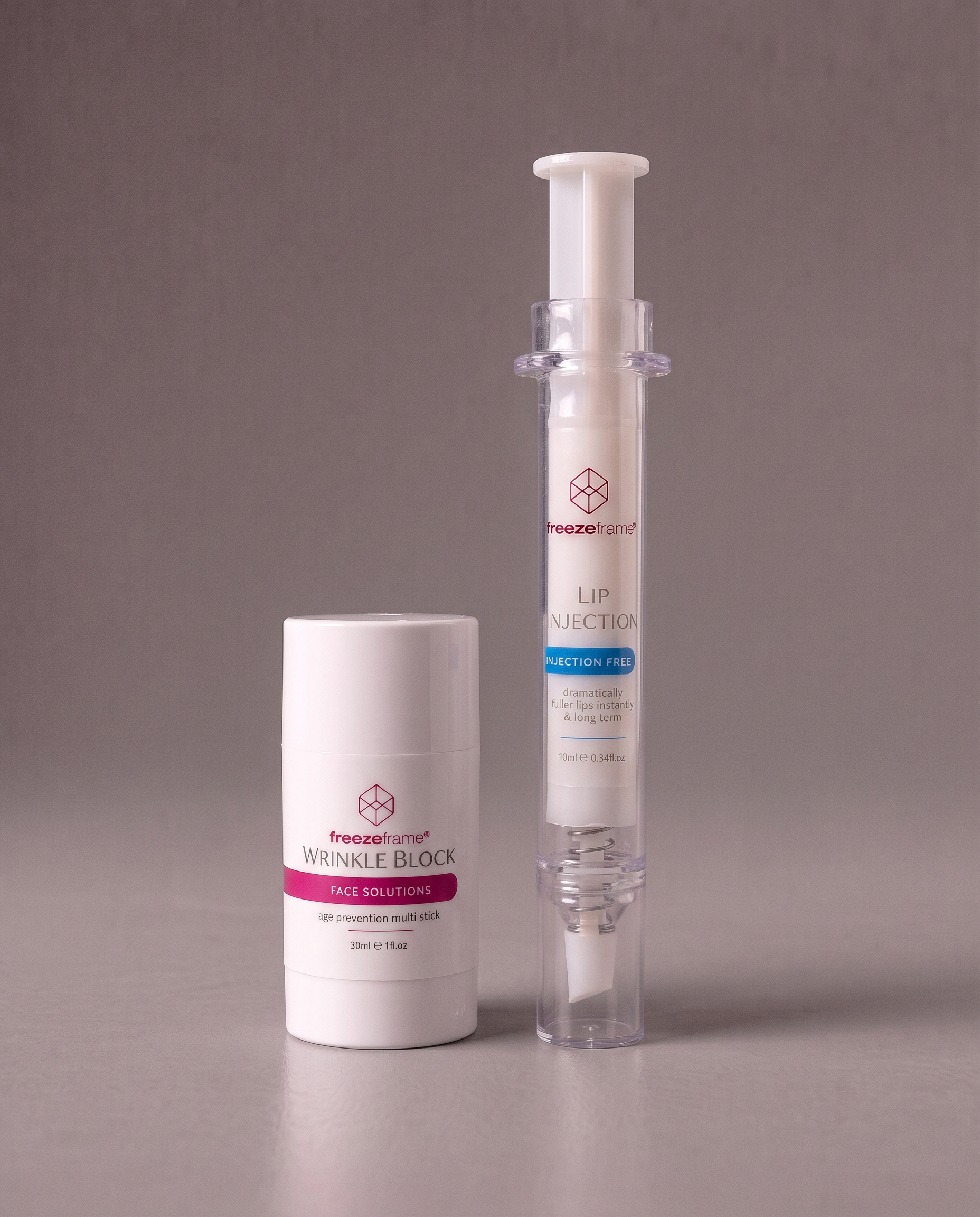 freezeframe PLUMP & FIRM SET featuring WRINKLE BLOCK 30ml age prevention multi stick and LIP INJECTION 10ml needle-free lip plumper, designed to smooth the appearance of wrinkles and create fuller-looking lips.