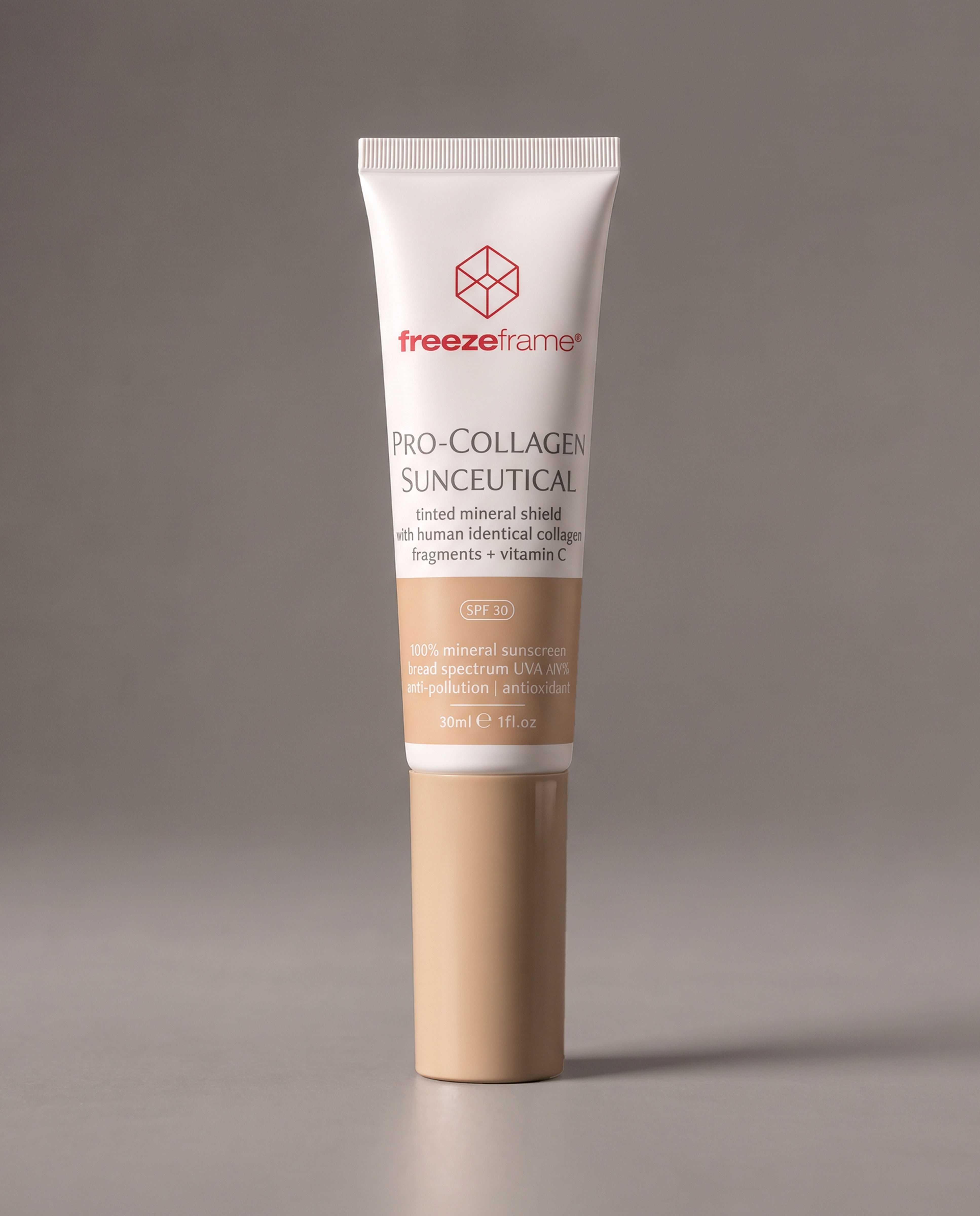 freezeframe PRO-COLLAGEN SUNCEUTICAL 30ml tinted mineral SPF 30 sunscreen with human-identical collagen fragments and vitamin C, in a white and beige tube for daily sun protection and skincare.