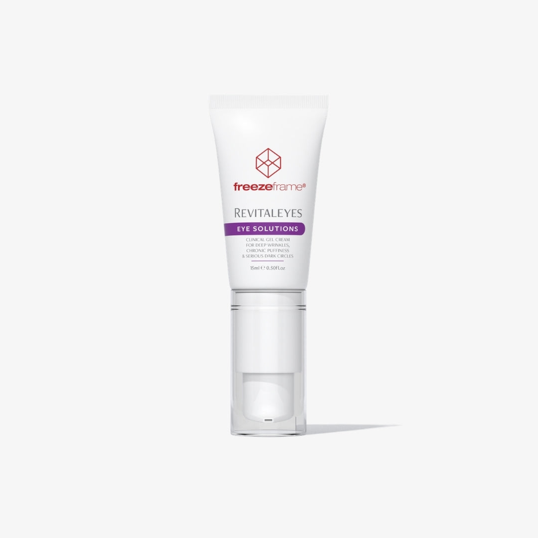 freezeframe REVITALEYES 15ml clinical eye gel serum in a white tube with a clear applicator cap, designed to target deep wrinkles, under-eye bags, puffiness and dark circles.