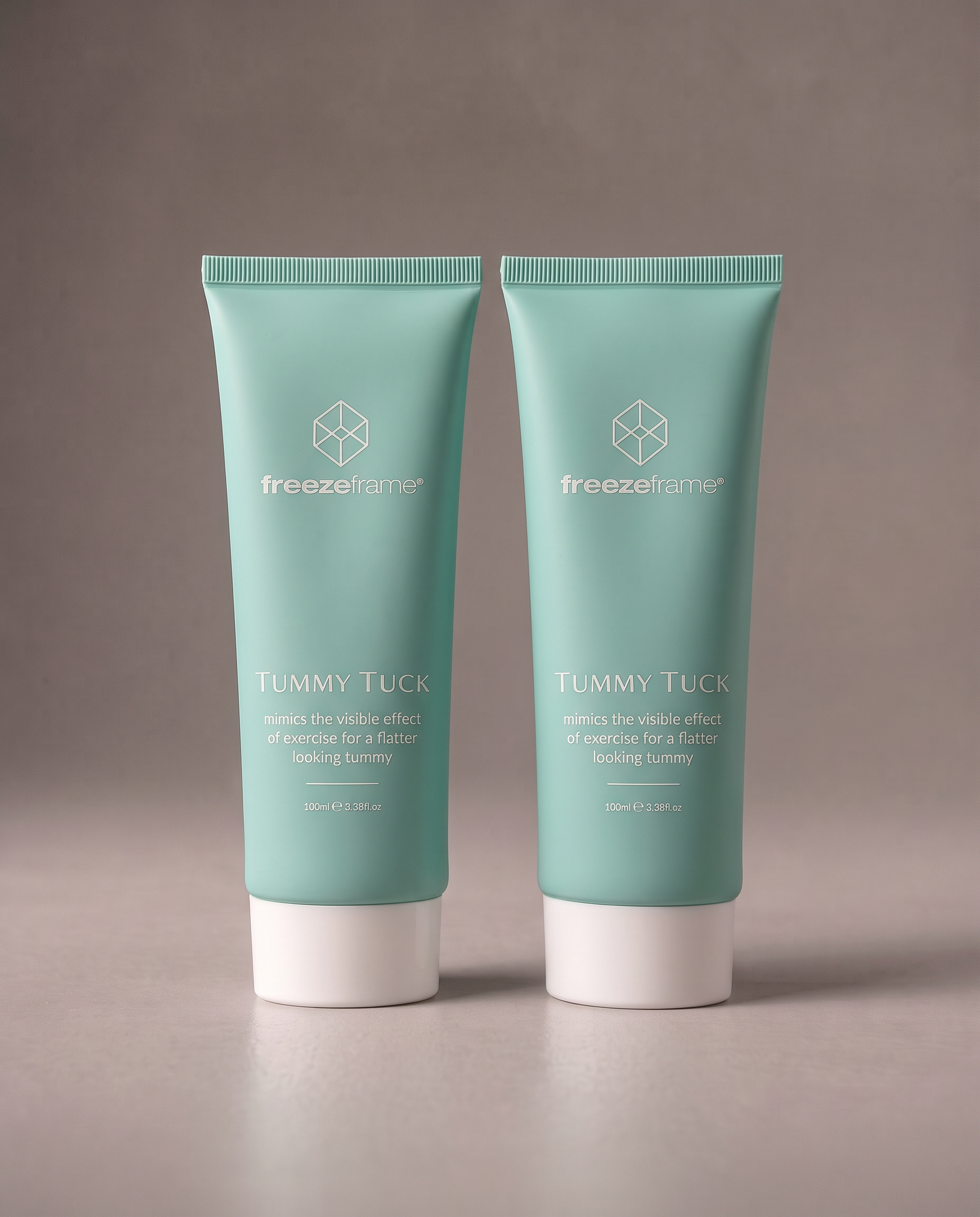 freezeframe TUMMY TUCK DUO featuring two 100ml tubes of TUMMY TUCK body contouring cream in turquoise packaging, designed to help create a firmer, flatter-looking tummy.