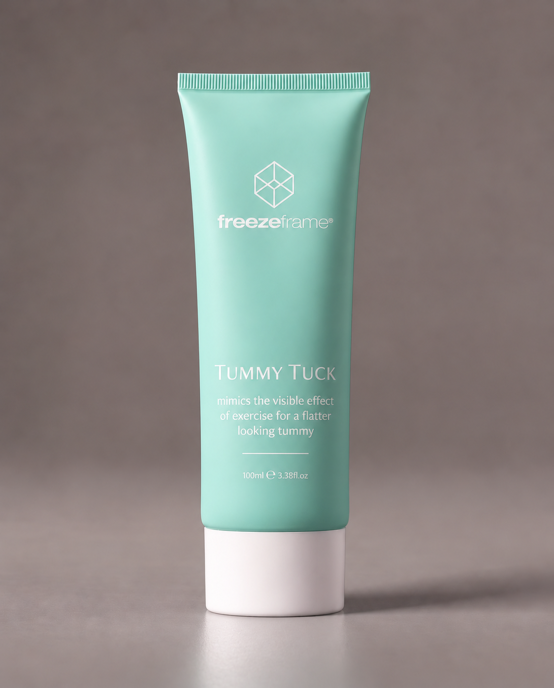 freezeframe TUMMY TUCK 100ml body firming cream in turquoise packaging, formulated to help improve the appearance of tummy firmness and create a smoother, flatter-looking stomach.